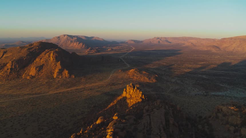 Desert mountain aerial at sunset