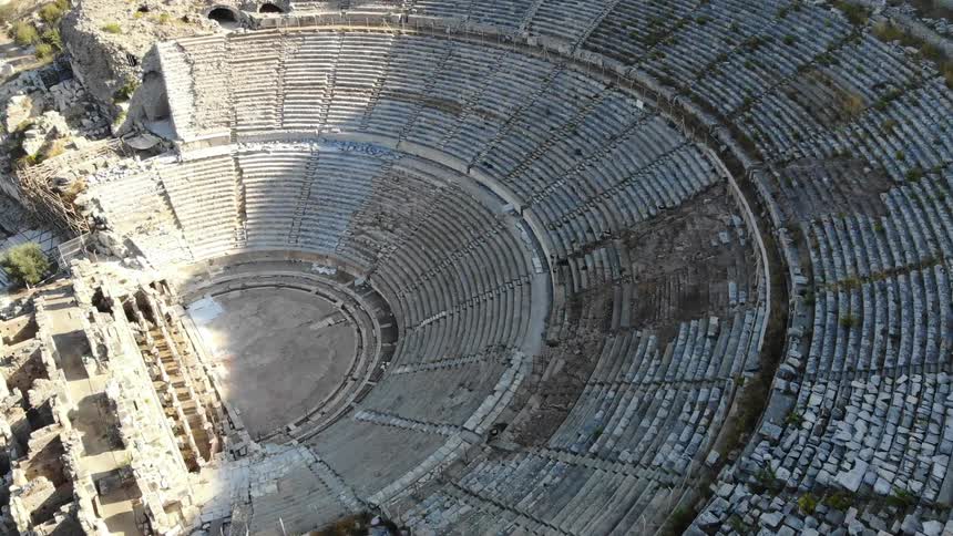 Crumbling stones are in ancient ruins of a stadium