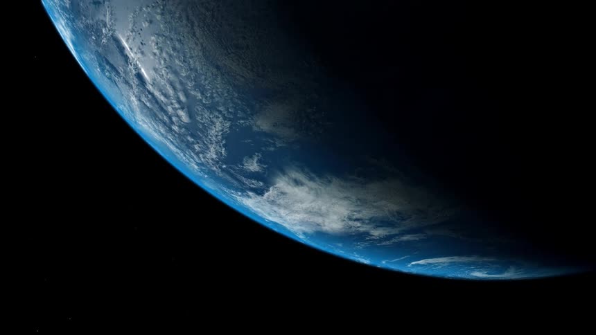 Clouds are hovering over ocean water on earth from outer space