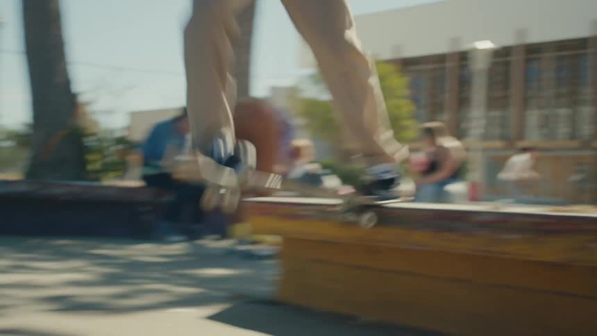 A man is riding a skateboard in a city location
