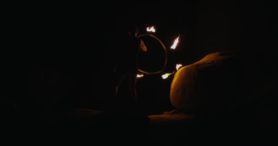 A person is waving a circle of fire