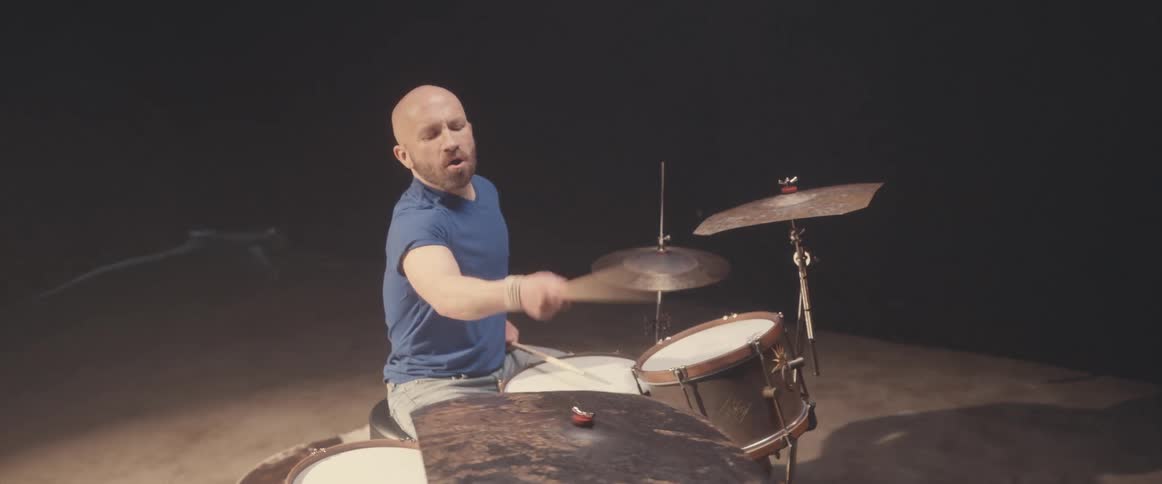 A man is playing the drums
