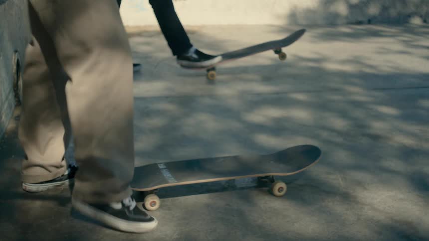 People ride off in the park on skateboards