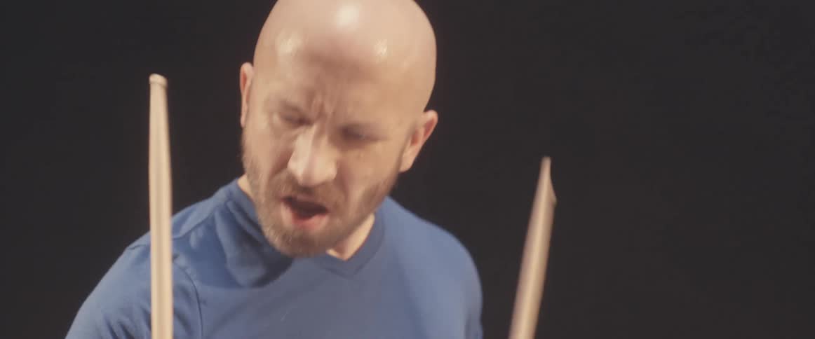 A man is playing the drums