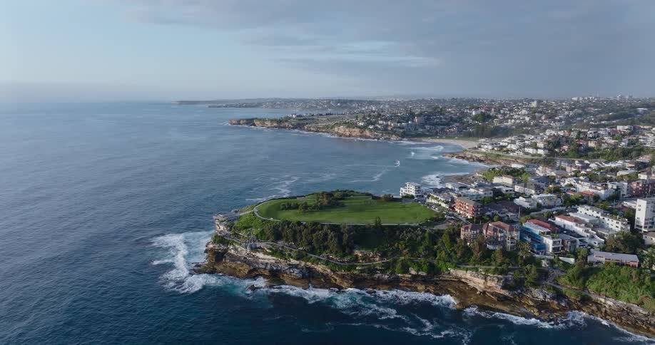Aerial view of a waterfront residential area in front of a beach close to the ocean