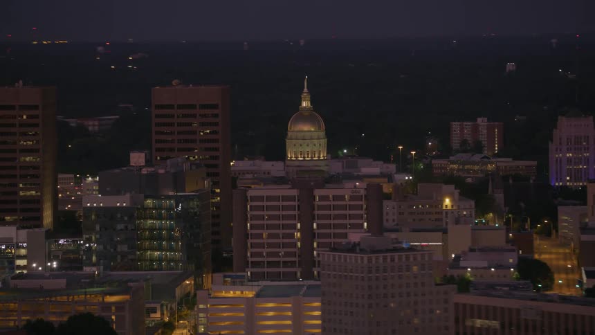 Buildings are lit up at night in a big city