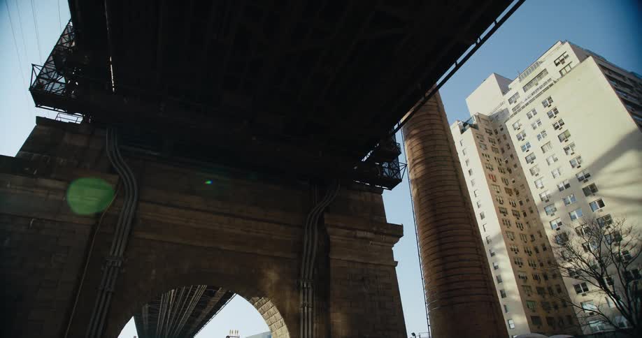The overpass is near the building