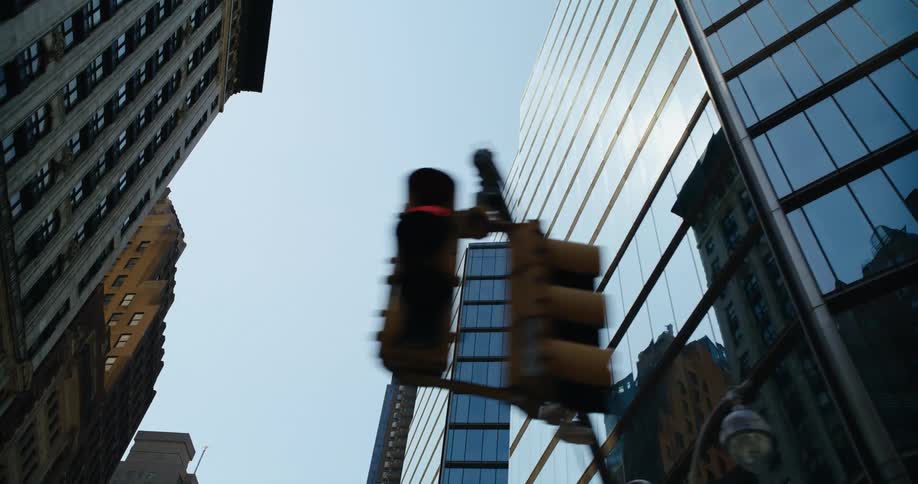 Sunlight and buildings are reflecting on windows in a city