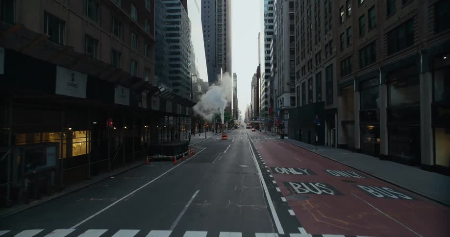 Slow motion footage of the empty lanes of a new york city avenue at evening