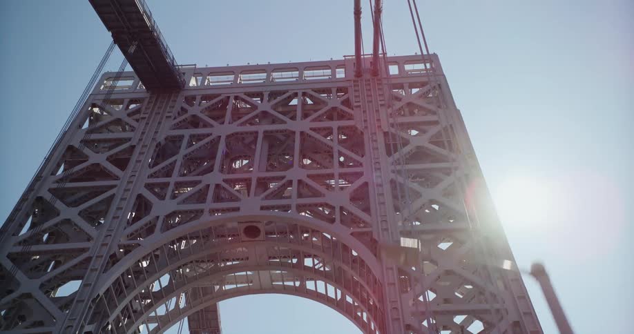 Vehicle crossing suspension bridge with tower and cables