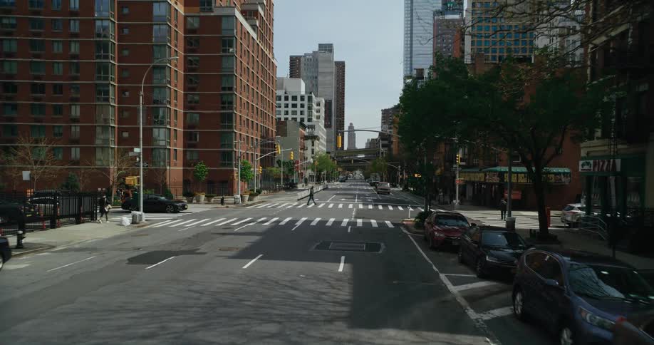 A man crosses the street in the city