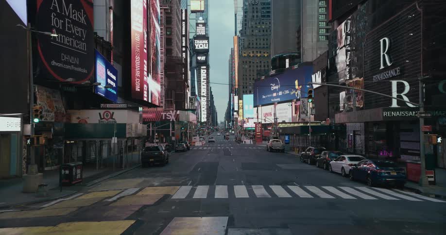 Slow motion footage of the empty lanes of time square in new york city at evening