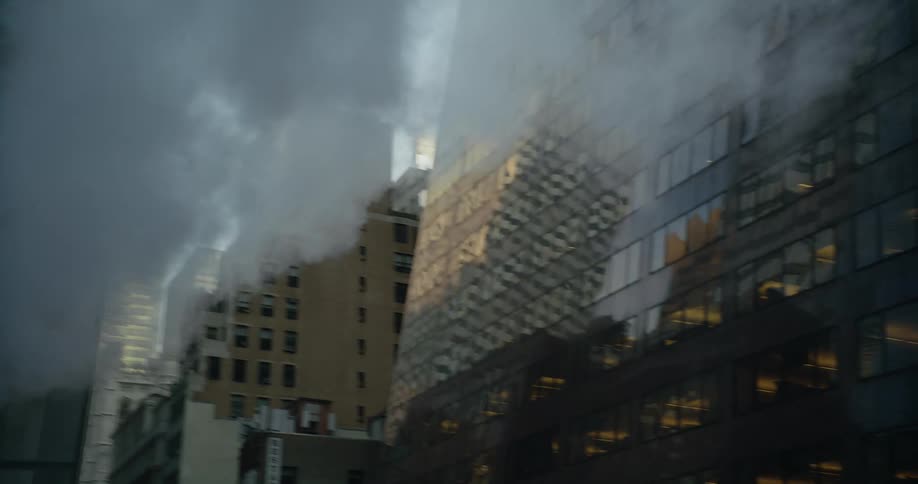 Smoke rises from the chimney on the building