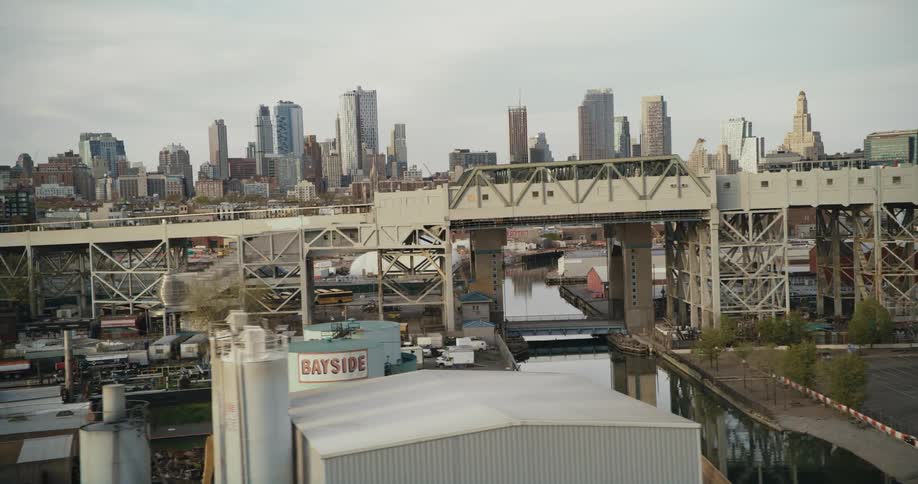 Businesses sit on the other side of a bridge across from downtown