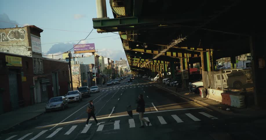 A view of people walking under a bridge