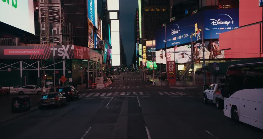 City downtown with highrise buildings and billboards at dusk