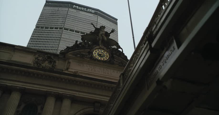 A statue of a man is on the building