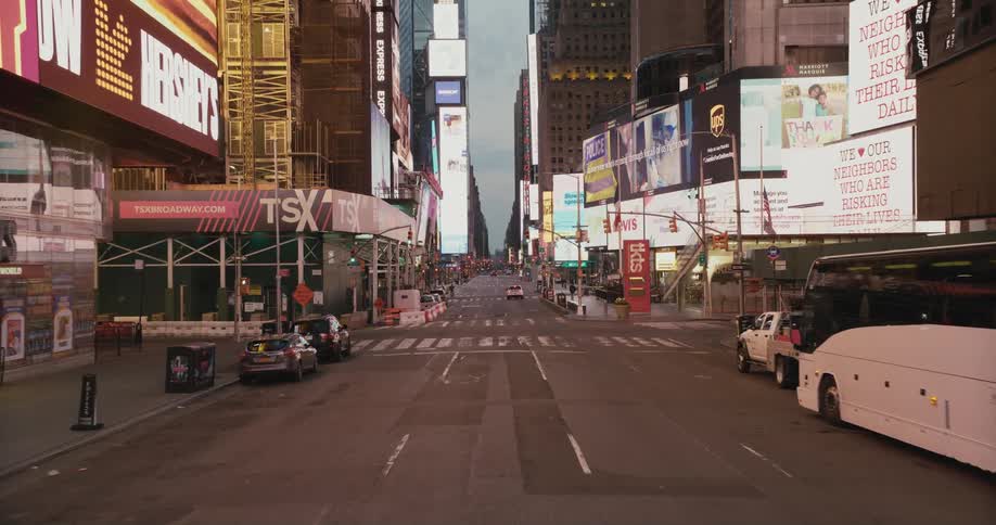 Slow motion footage of the empty lanes of time square in new york city at evening