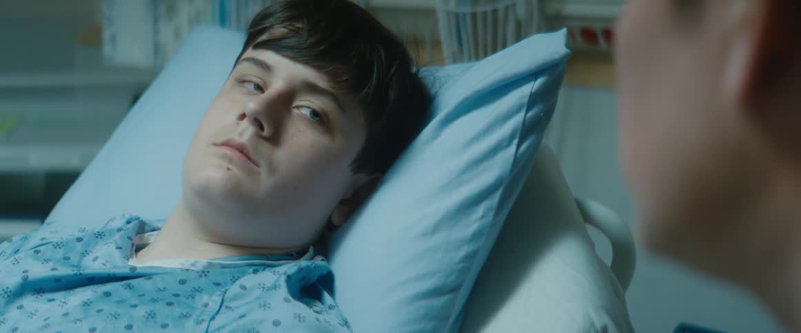 A patient lies in the hospital bed
