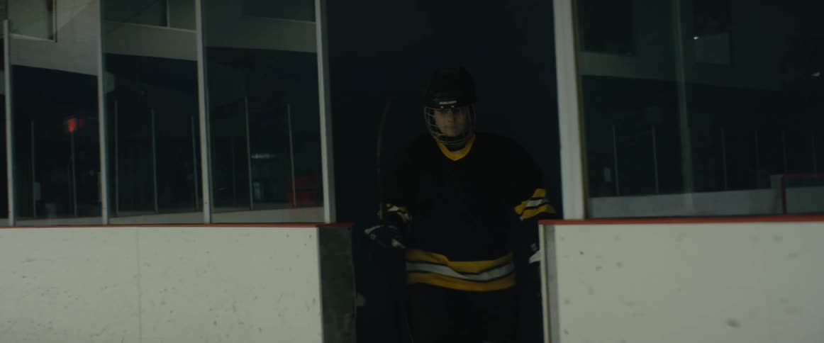 Ice hockey player wearing the team uniform enters the skating rink