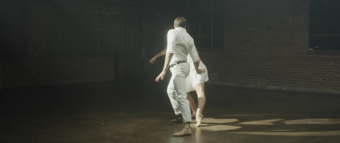Man and woman are dancing together during a performance