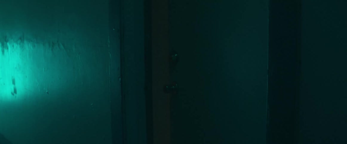 An empty hallway in a building is displayed