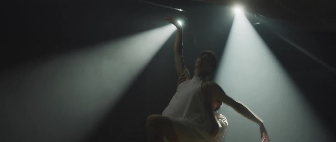 A man and woman dancing on a stage
