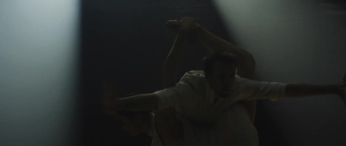 A man and woman dancing on a stage