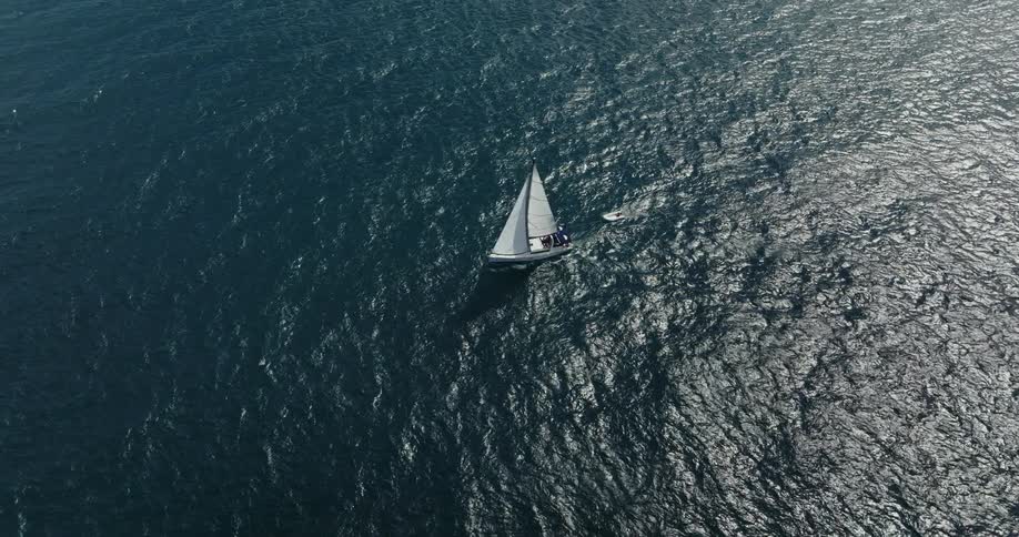 Aerail view of boat sailing on ocean water