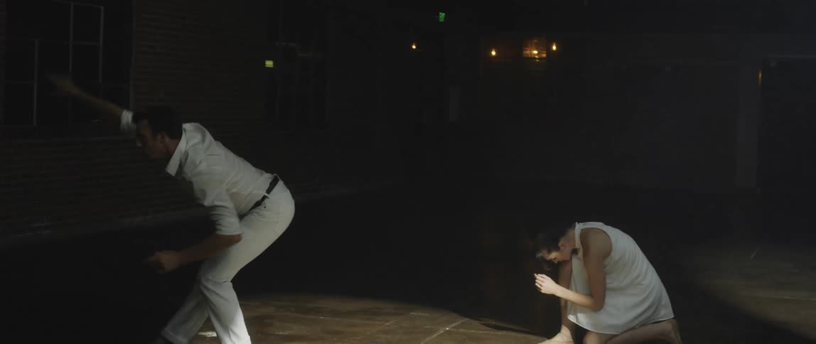Two people dancing on a stage