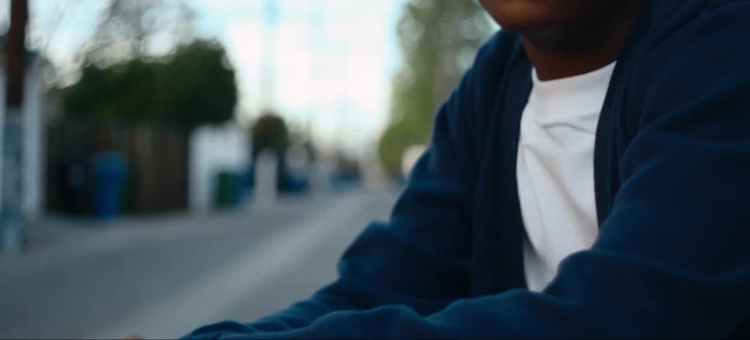 A boy sits in the alley