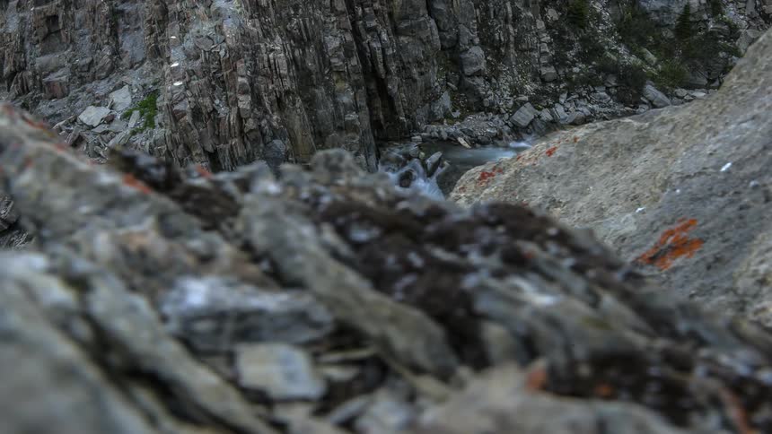 Time lapse of water flowing down a mountain from the top