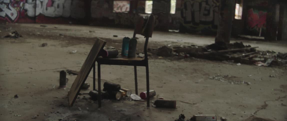 A view of a seat in an abandoned warehouse
