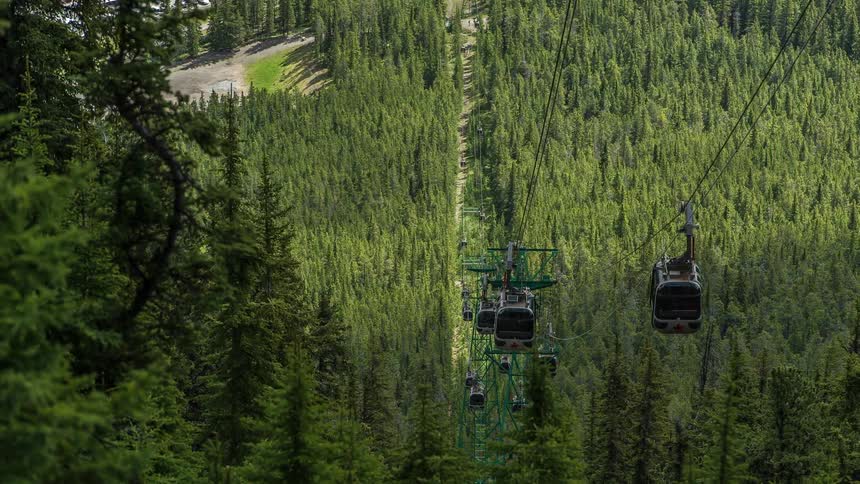 Time lapse of ski lifts transporting back and forth