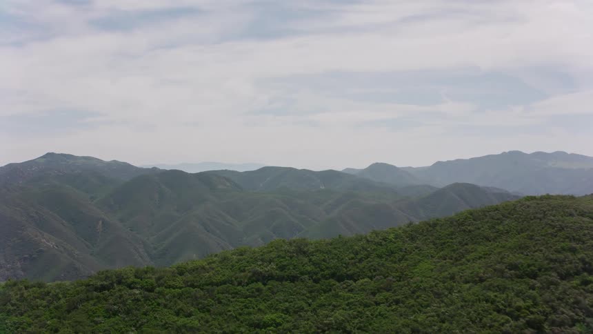 The mountains are covered in fog