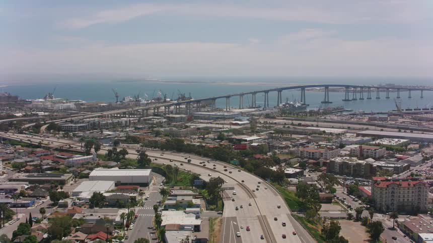 Traffic moves through the city on a cloudy day