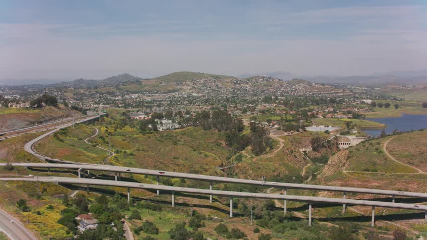 Vehicles travel on the roads over the hills