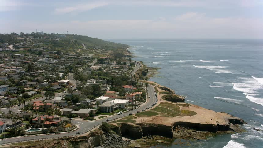 The waves move towards the coastal town