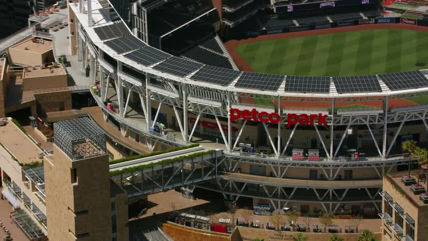 Aerial view of a baseball stadiumo in the city downtonw at daytime