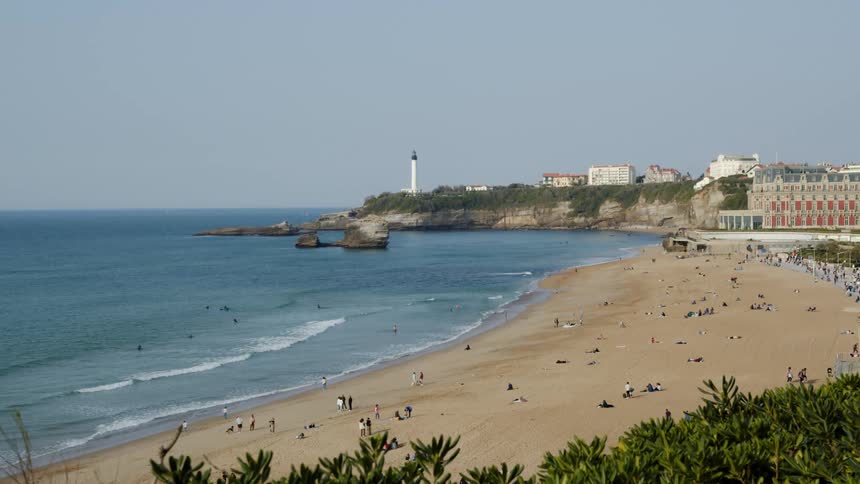 People are relaxing at the beach during the day time
