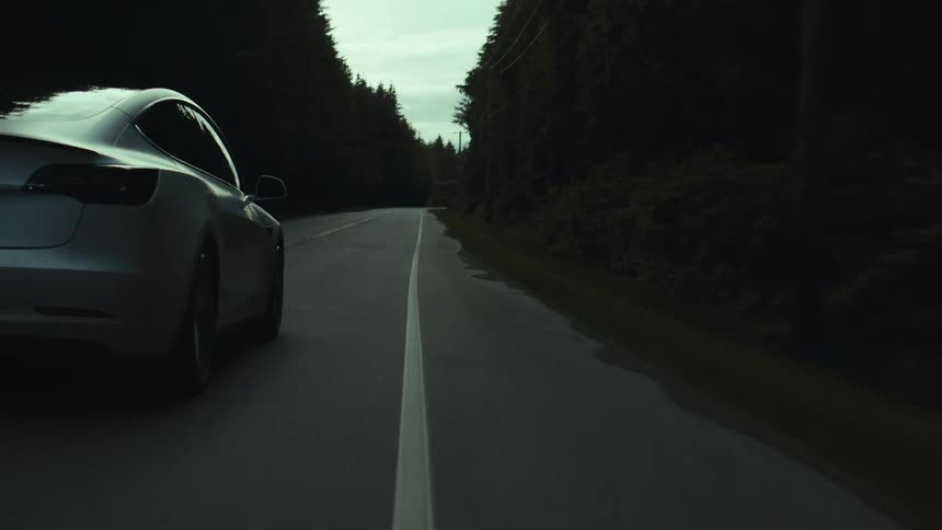 A car is driving on the highway