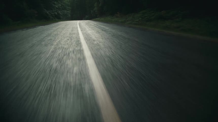 A road is displayed on camera in a rural area
