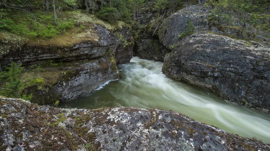 Time lapse of a stream surrounded by rocks