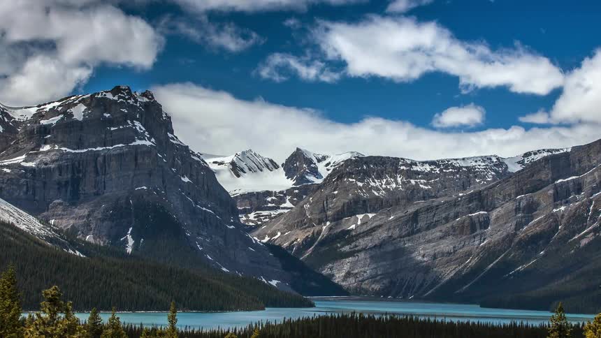 Clouds over snowy mountains