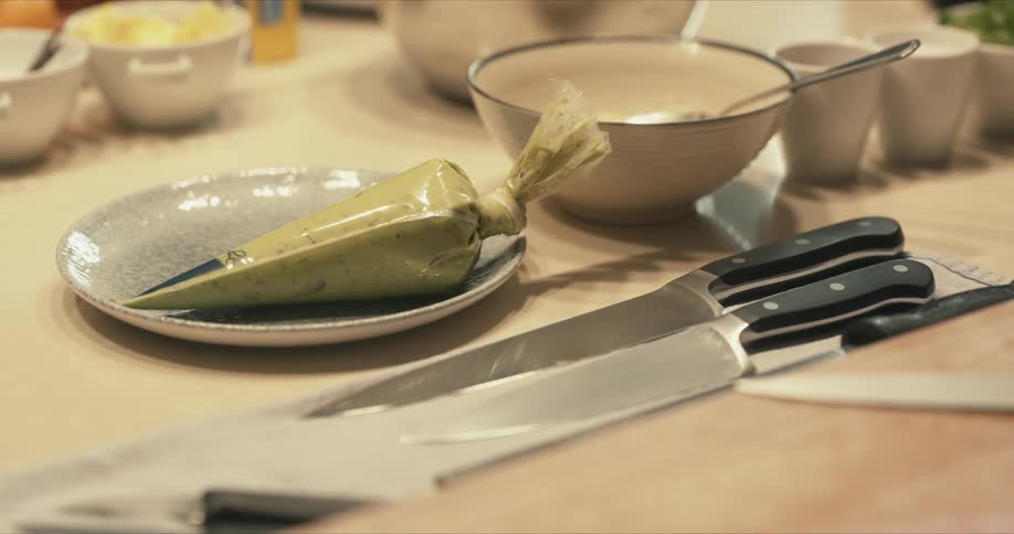A view of food and knives on a table
