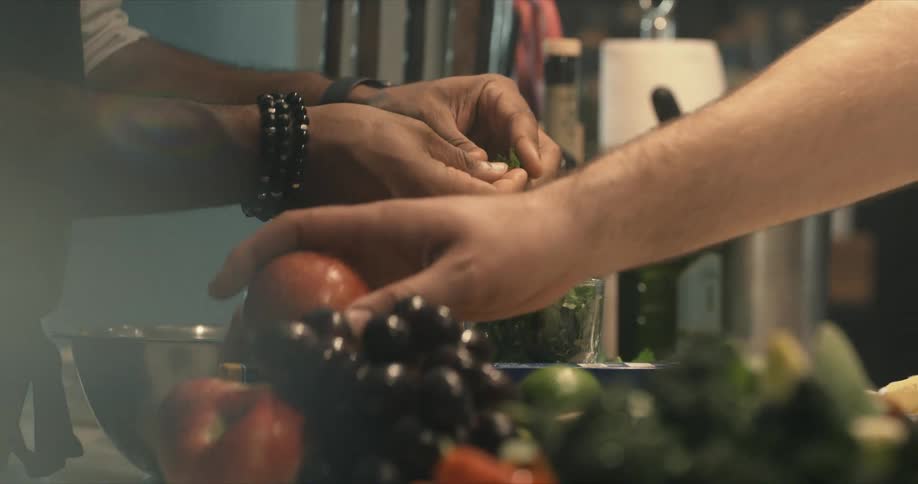 Two cooks prepare food together