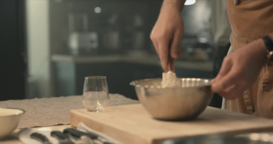 A person cooking food in a kitchen