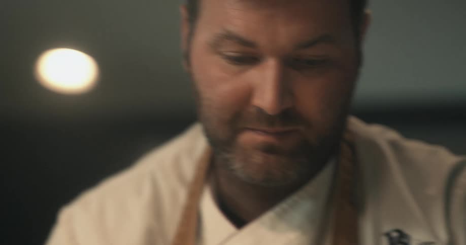 Close up of the face of a chef cooking at home