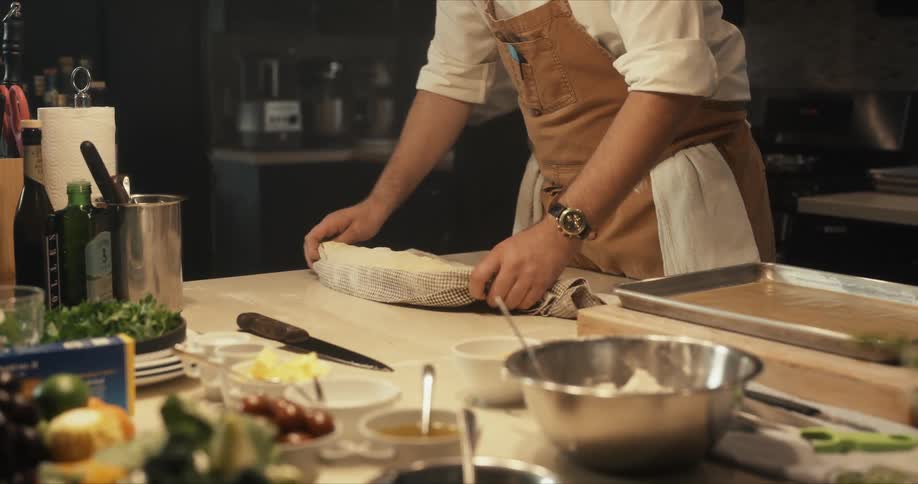 A person cooking food in a kitchen