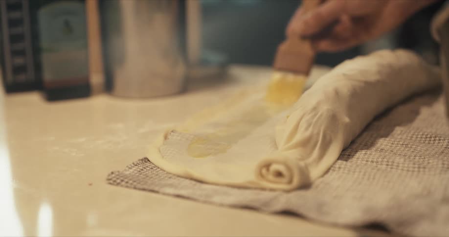 A person is basting some food